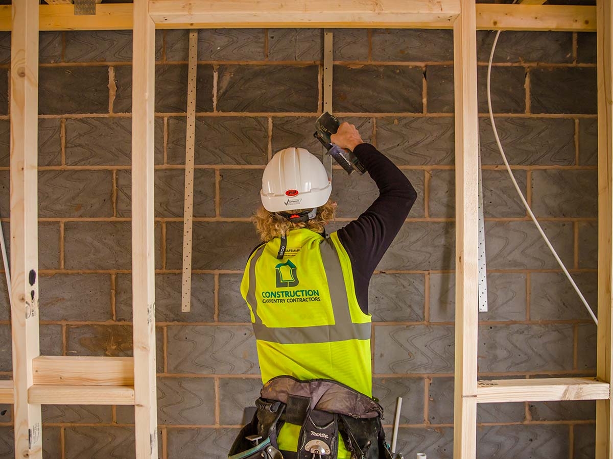 Carpentry contractor working on new build house