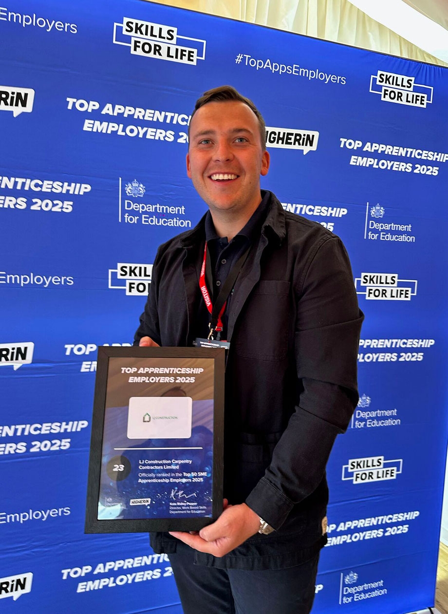 Ryan Jones from LJ construction with award for 23rd best top apprenticeship employer 
