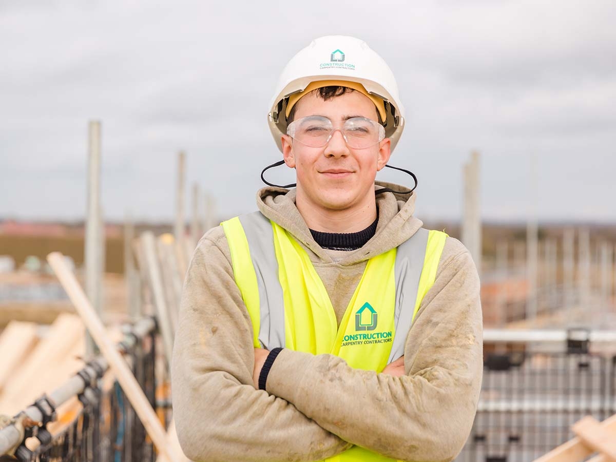 Carpentry contractor on site in LJ construction branded PPE